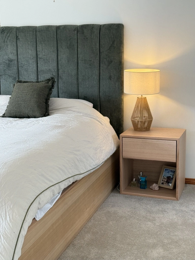 Timber bedside table in a bedroom