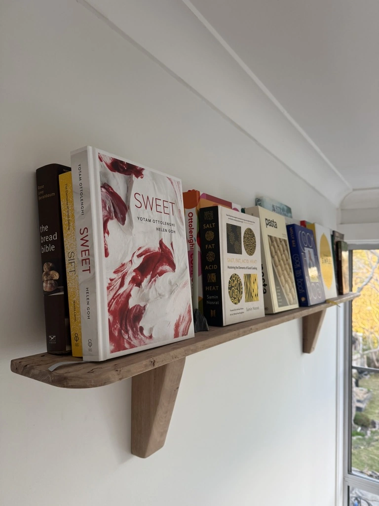 Timber wall-mounted bookshelf