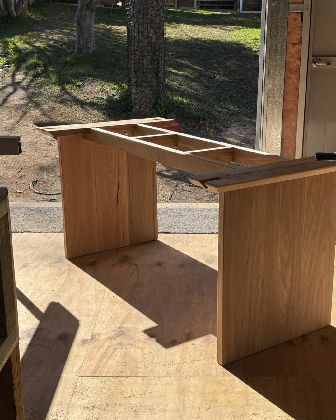 Underside construction of a custom spotted gum dining table base