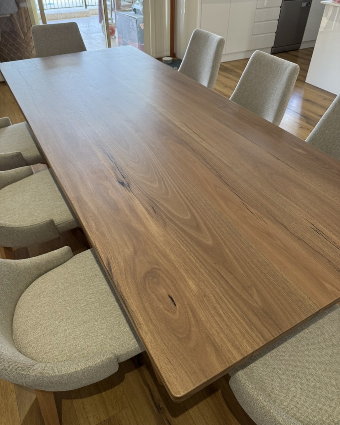 Natural grain and edge detail on a solid spotted gum tabletop