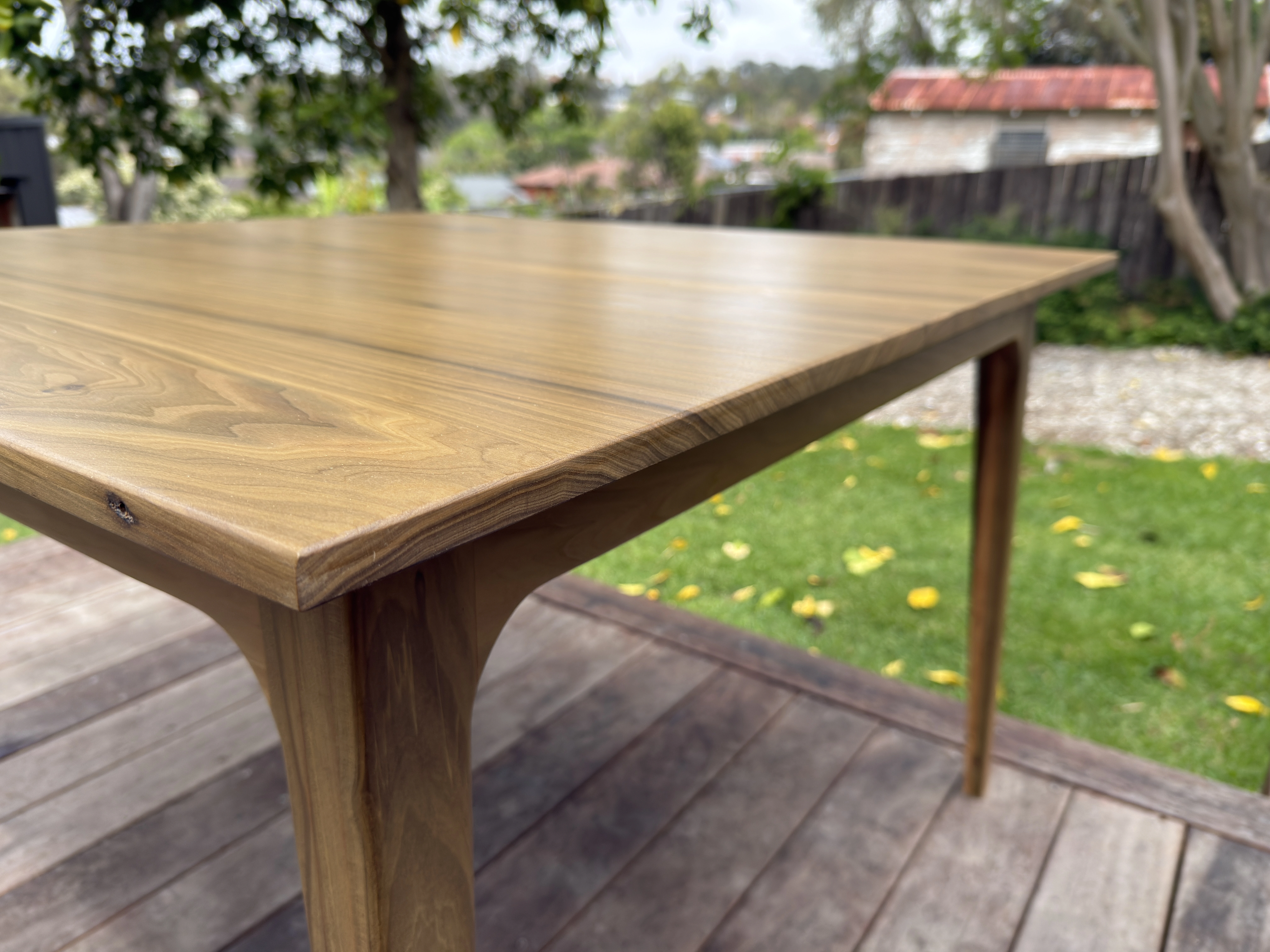 Teak tabletop grain, corner and edge detail